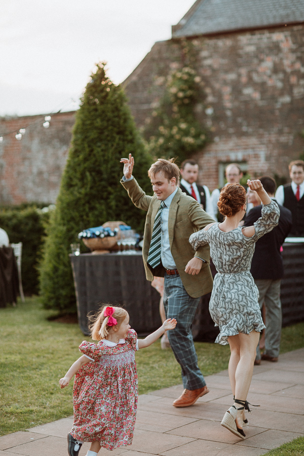 groom dancing with her sister outdoors at dumfries house