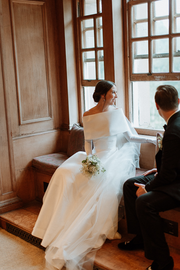 Dumfries House Wedding Photos newlyweds looking through the window