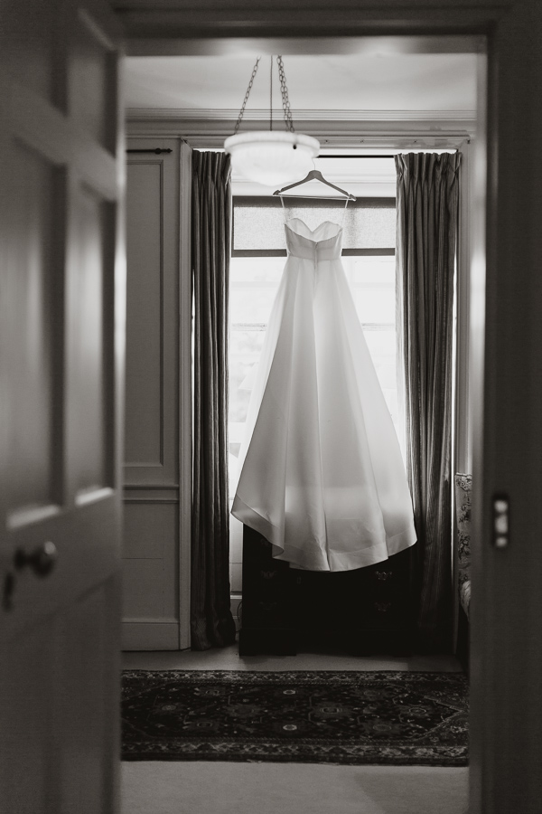 view of the room with dress hanging