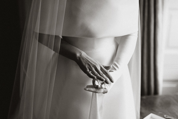 bride putting her gloves on 