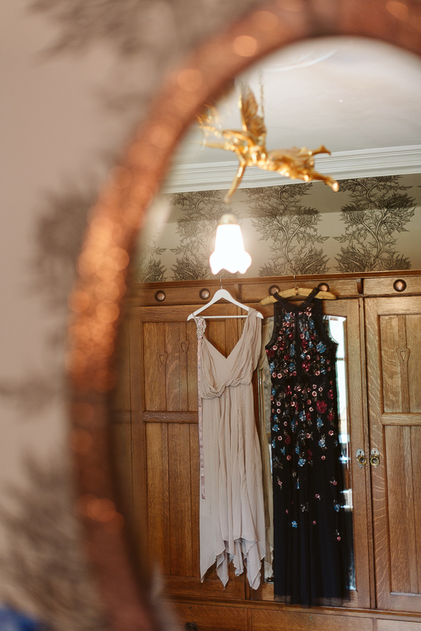 dresses hang in the bathroom at the lodge